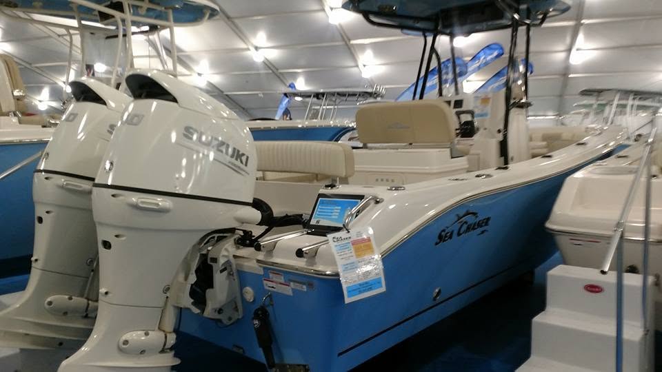 Second custom tablet specification stand installed beside a blue Sea Chaser boat