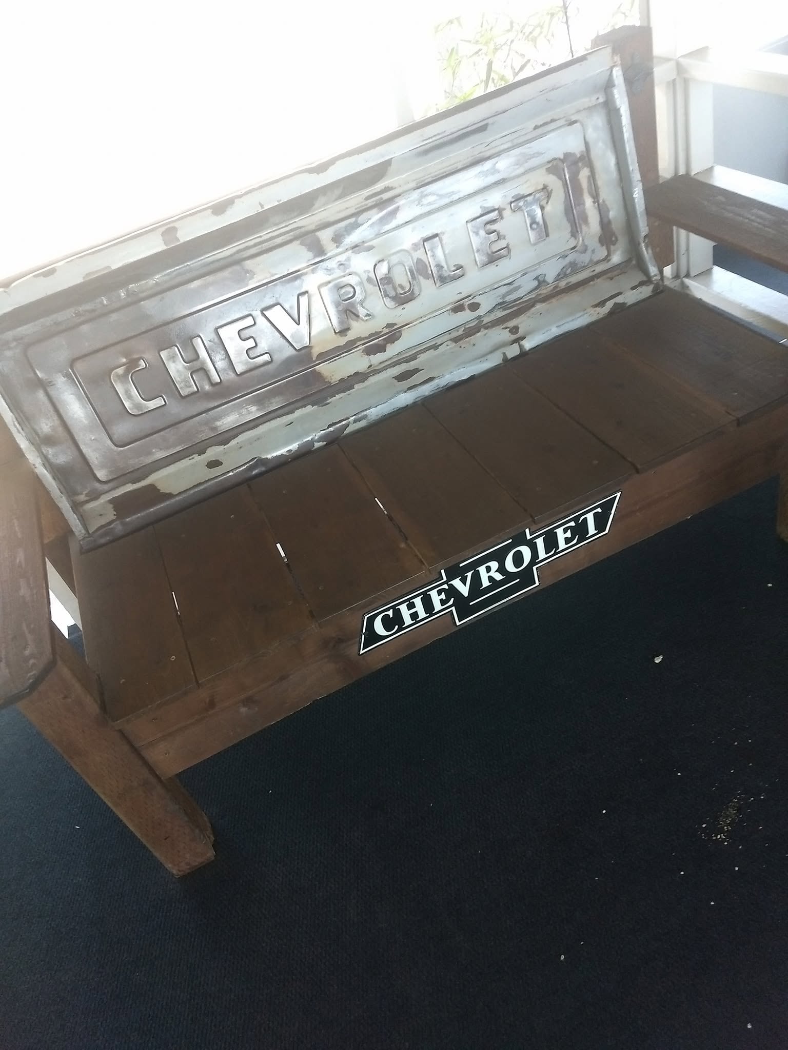 Hand-built bench made from a Chevrolet truck tailgate