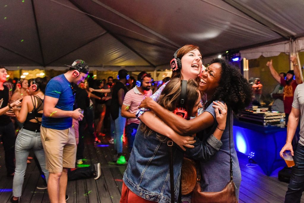 Florida silent disco crowd wearing illuminated headphones